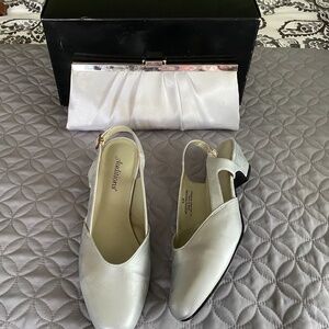 Silver low heel shoes with matching clutch bag